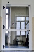 Porte vetrate REI 60 in alluminio ad una anta